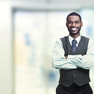 young businessman with is arms crossed. 