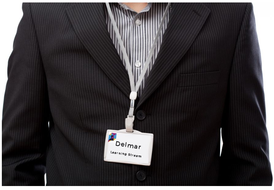 Attendee wearing a name badge with name and company