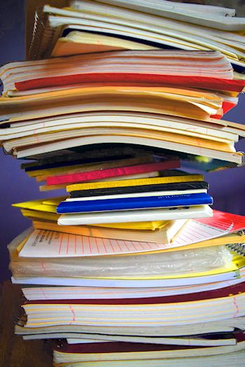print versus digital: stack of notebooks and paper pads