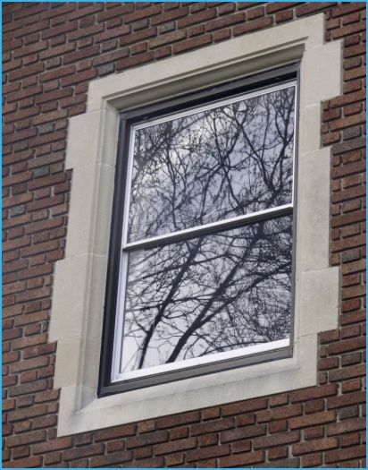 A photo of a window in a brick building