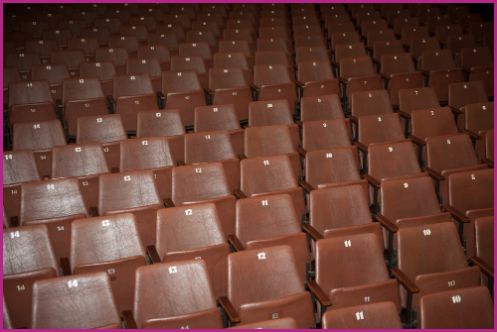 an auditorium with empty seats