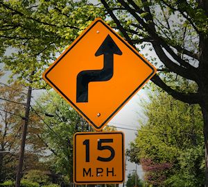 Highway warning sign for curves ahead