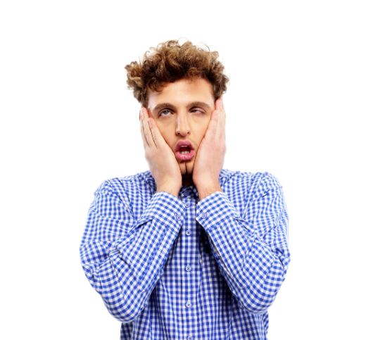 A man holding his face with both hands in expression of boredom.