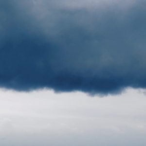 Bank of blue clouds above a lighter horizon