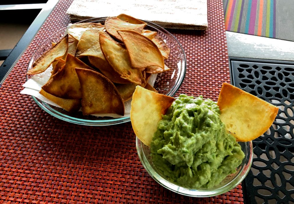 Guacamole and chips on a table